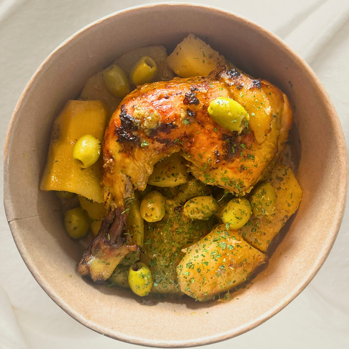 Tajine de poulet aux olives, citron confit & pommes de terre